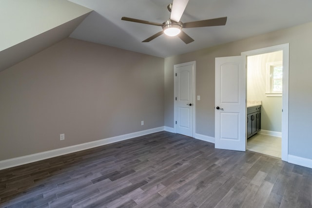 bonus room with ceiling fan and dark hardwood / wood-style floors