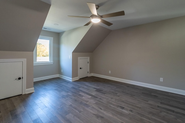 additional living space featuring ceiling fan, lofted ceiling, and dark hardwood / wood-style flooring