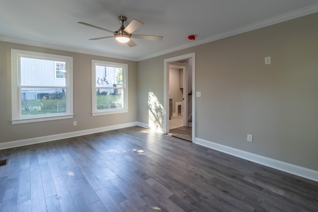 spare room featuring ornamental molding, dark hardwood / wood-style floors, and ceiling fan