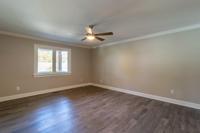 empty room with crown molding, ceiling fan, and dark hardwood / wood-style flooring