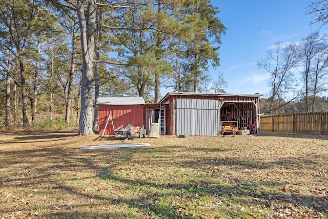 view of outbuilding with a yard