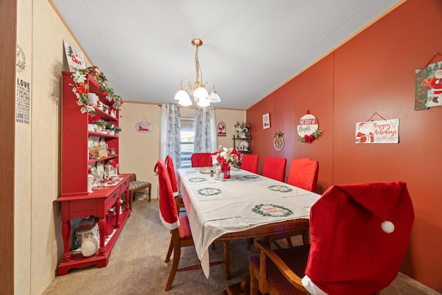 dining space with an inviting chandelier, carpet floors, and ornamental molding