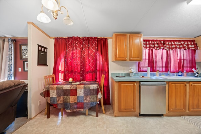 kitchen featuring an inviting chandelier, stainless steel dishwasher, and sink