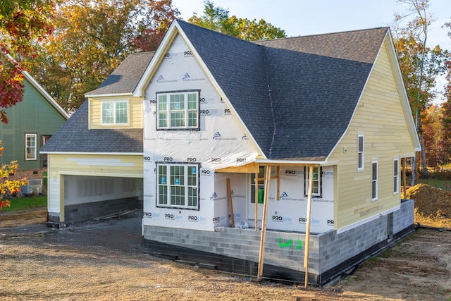 unfinished property featuring a garage