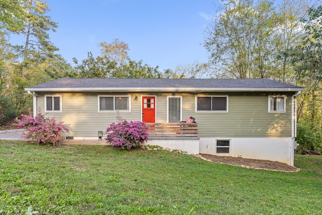 single story home featuring a front lawn