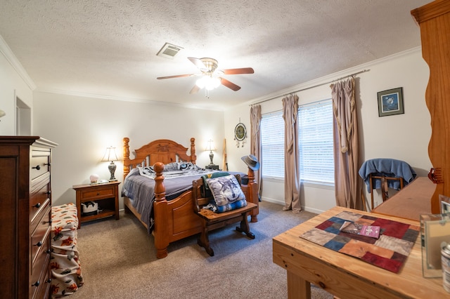 carpeted bedroom featuring ceiling fan, a textured ceiling, and ornamental molding