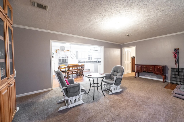 carpeted living room featuring ornamental molding, a textured ceiling, and an inviting chandelier