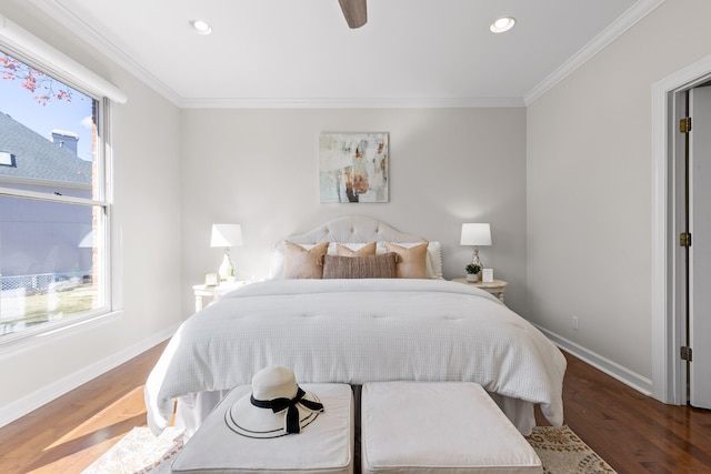 bedroom featuring ceiling fan, wood-type flooring, and crown molding