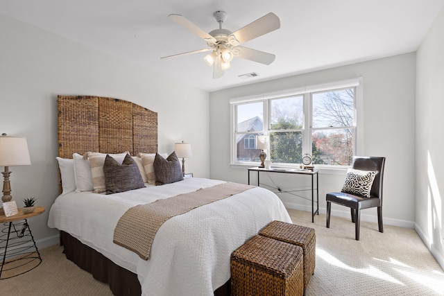 bedroom featuring ceiling fan and light colored carpet