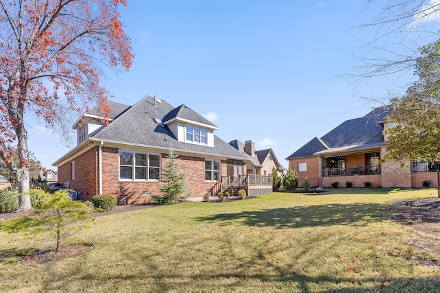 exterior space featuring a lawn and a wooden deck