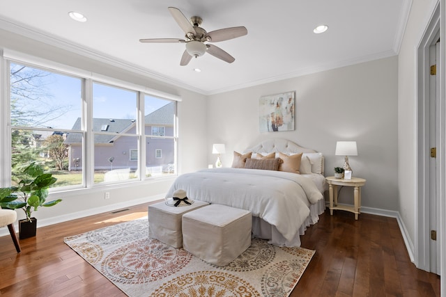 bedroom with multiple windows, ceiling fan, crown molding, and dark wood-type flooring