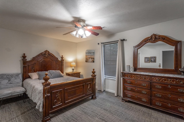 bedroom with a textured ceiling, carpet flooring, and ceiling fan