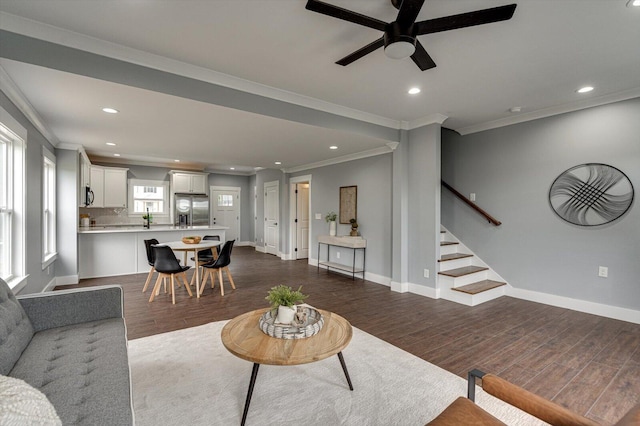 1318 Unity Dr NE, Cleveland, TN 37312 - living room featuring ceiling fan, ornamental molding, recessed lighting, dark wood-type flooring, and stairs