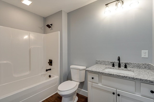 1318 Unity Dr NE, Cleveland, TN 37312 - bathroom featuring vanity, toilet, wood finished floors, washtub / shower combination, and baseboards