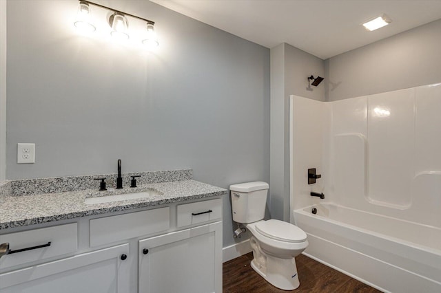 1318 Unity Dr NE, Cleveland, TN 37312 - full bathroom with toilet, wood finished floors, vanity, washtub / shower combination, and baseboards