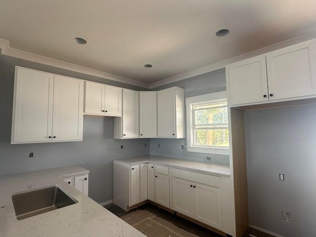 kitchen featuring sink, dark hardwood / wood-style floors, and white cabinets