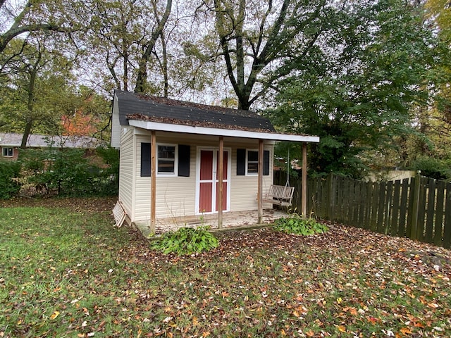 view of outbuilding featuring covered porch