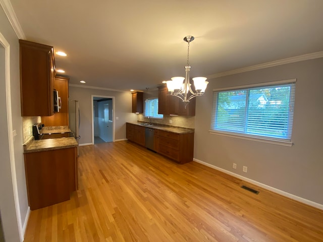 kitchen with stainless steel appliances, light hardwood / wood-style flooring, and ornamental molding