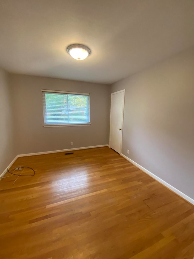 spare room featuring hardwood / wood-style flooring