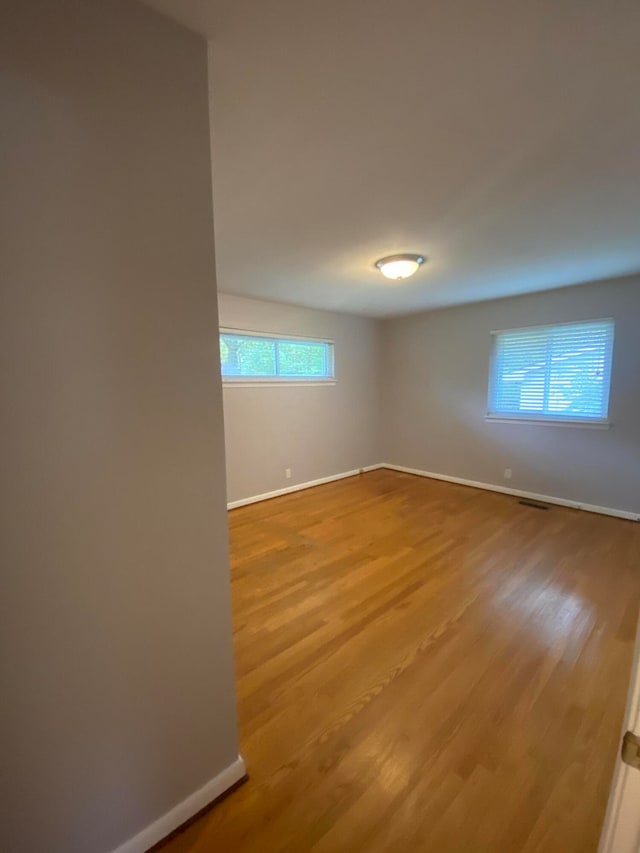 spare room featuring light hardwood / wood-style flooring