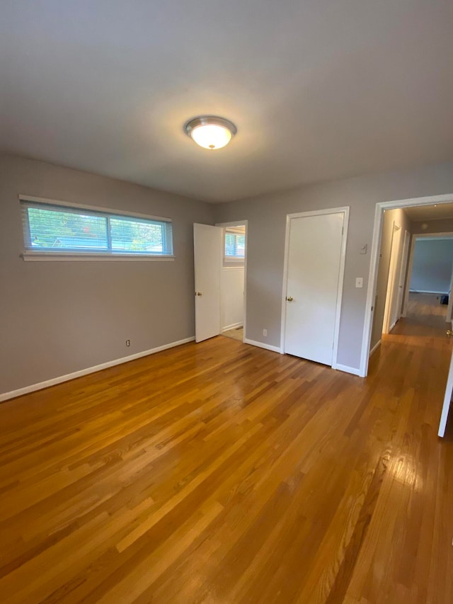 unfurnished bedroom featuring hardwood / wood-style floors