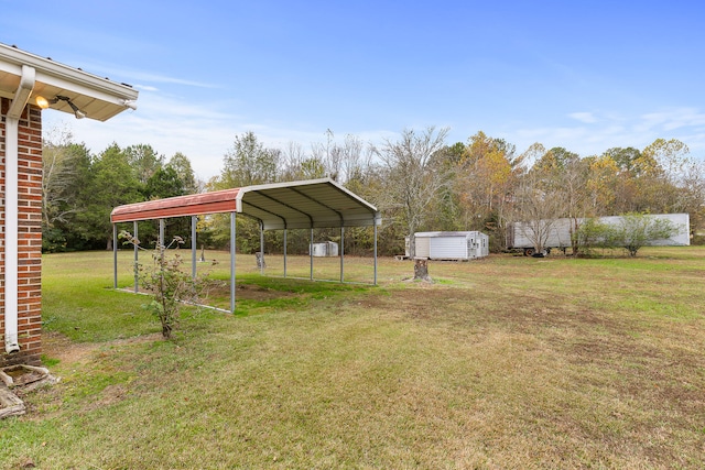 view of yard featuring a storage shed and a carport