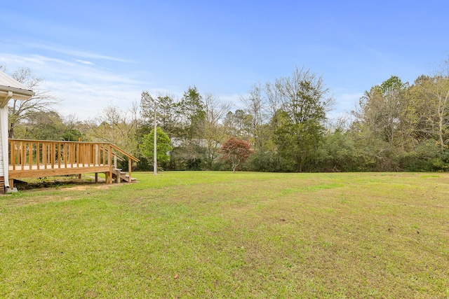 view of yard with a deck