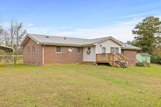 back of property featuring a deck, a shed, and a lawn