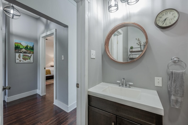 bathroom featuring vanity and hardwood / wood-style flooring