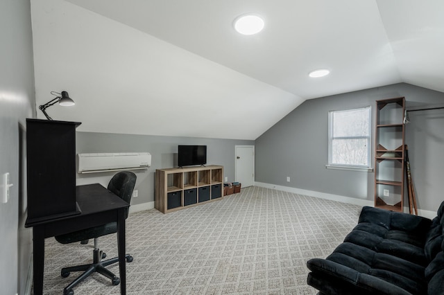 carpeted office with a wall mounted AC and vaulted ceiling