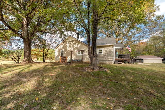 exterior space featuring a deck and a yard