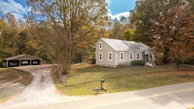 view of front facade featuring a carport and a front yard