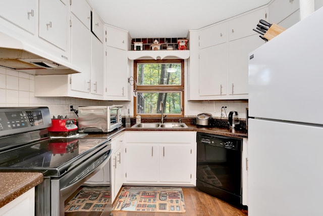 kitchen with stainless steel electric stove, dishwasher, white refrigerator, and white cabinets