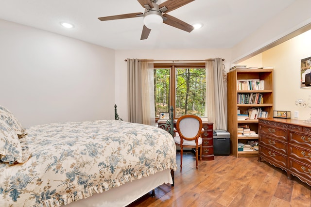 bedroom featuring hardwood / wood-style flooring and ceiling fan