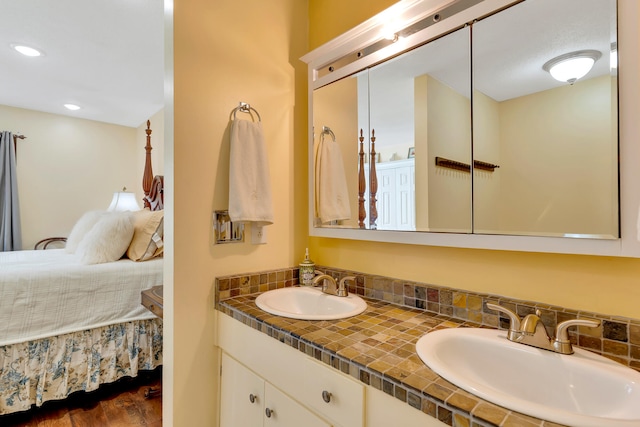 bathroom featuring vanity and hardwood / wood-style floors