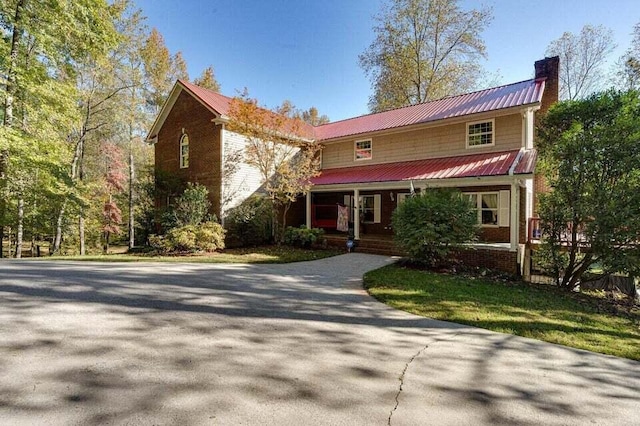 front of property featuring covered porch