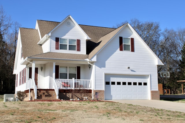 view of front of house featuring covered porch and a garage