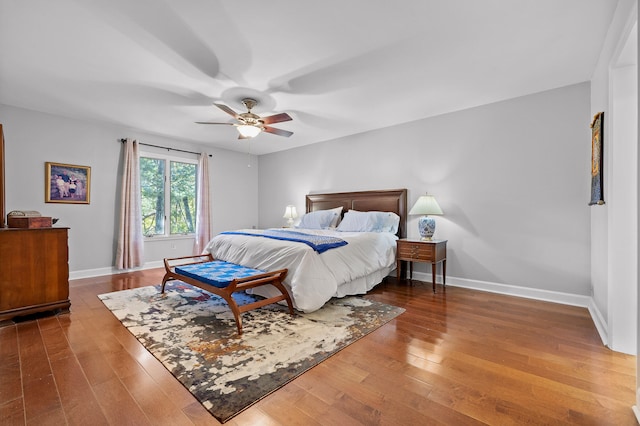 bedroom with hardwood / wood-style flooring and ceiling fan