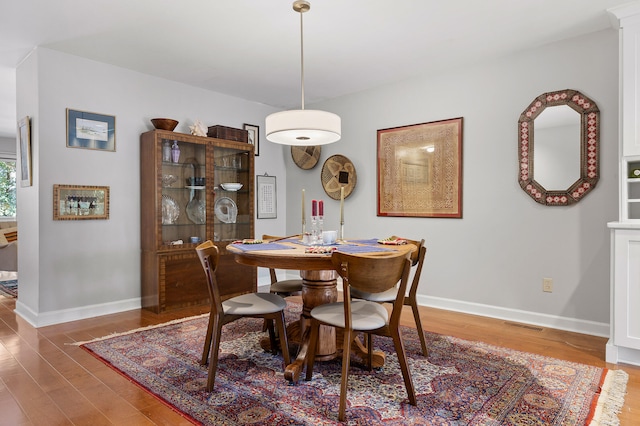 dining area featuring hardwood / wood-style floors