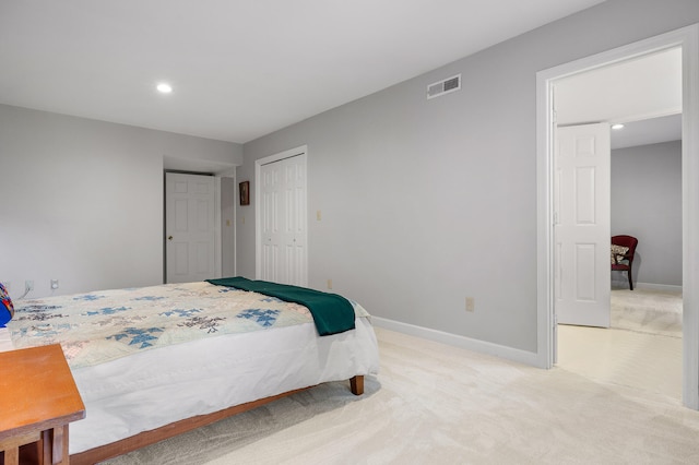 carpeted bedroom with a closet