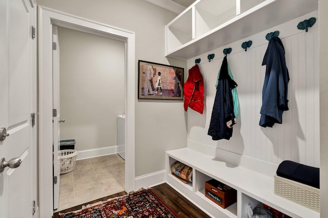 mudroom with tile patterned flooring and baseboards