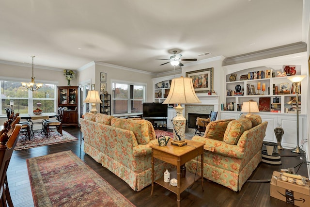 living room featuring ceiling fan with notable chandelier, crown molding, and dark hardwood / wood-style flooring