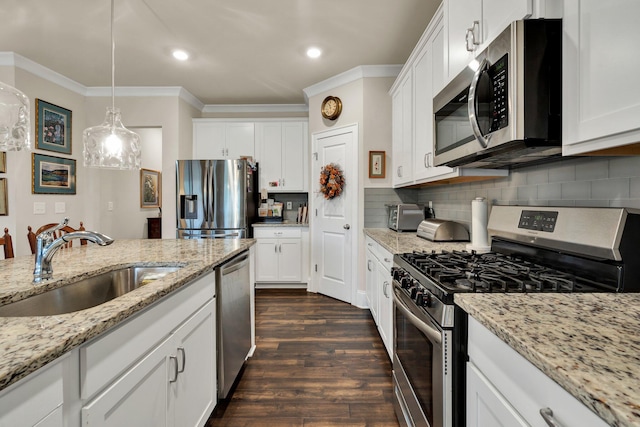 kitchen featuring appliances with stainless steel finishes and white cabinets