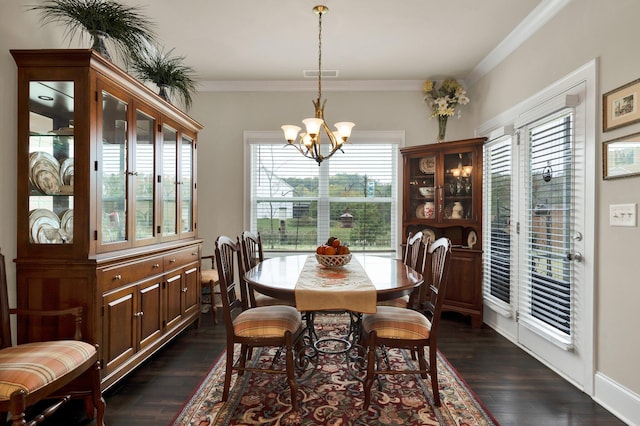 dining area with a wealth of natural light, dark hardwood / wood-style floors, and ornamental molding