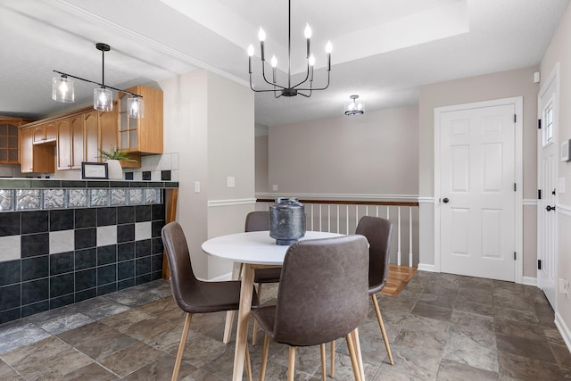 dining area with tile walls and a textured ceiling