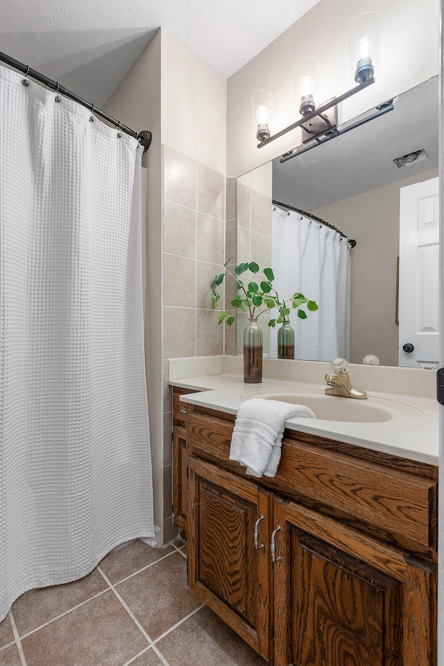 bathroom with vanity and tile patterned floors