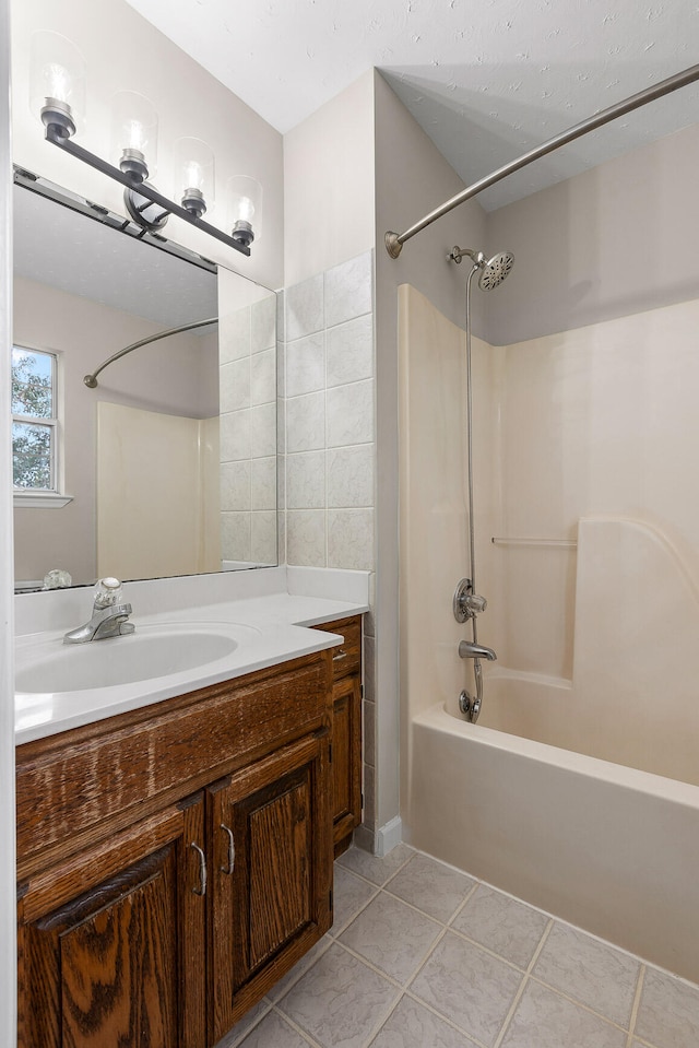 bathroom with shower / bathing tub combination, vanity, and tile patterned floors