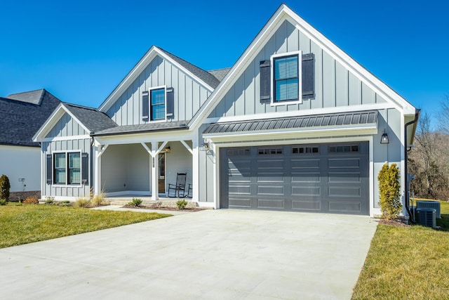 modern farmhouse style home with driveway, roof with shingles, a porch, board and batten siding, and a front yard