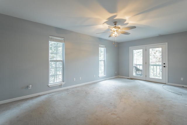 spare room with light carpet and ceiling fan