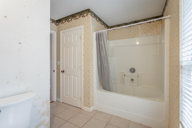 bathroom with toilet, tile patterned flooring, and shower / bathtub combination with curtain